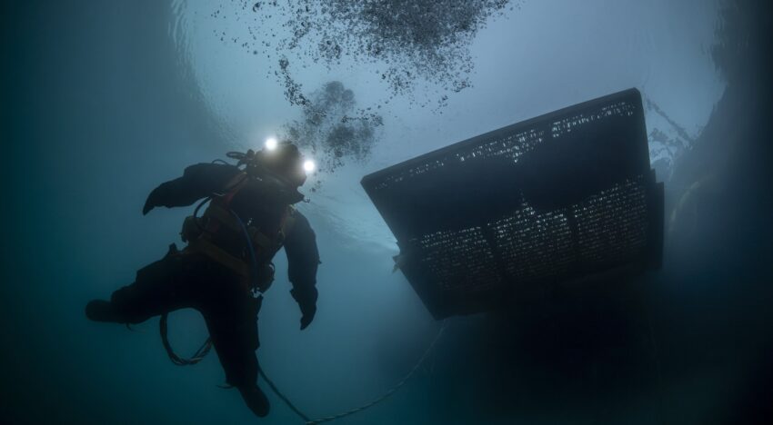 TUF International certified commercial diver performing underwater inspection in low visibility conditions